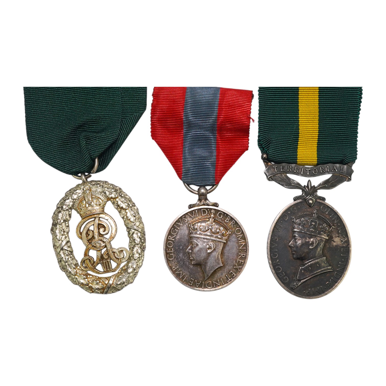 Three assorted service medals; Ed VII Volunteer Officer's Decoration hallmarked for 1905; GV Imperial Service medal to Walter Charles Cornish; GVI Territorial Efficiency medal to 2062789 . S/Sgt. L.W.Sergeant. R.A. Condi